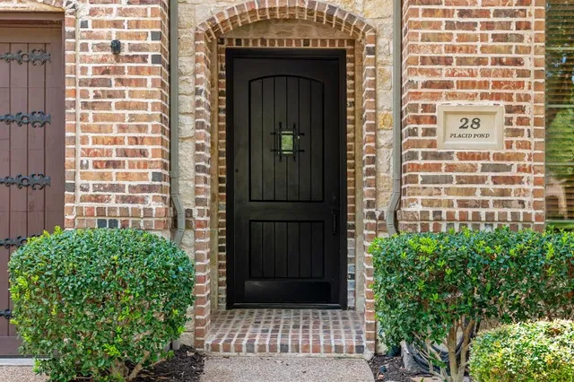 a view of front door of a house with a window