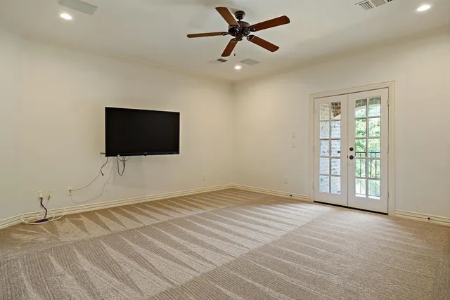 a view of an empty room with a flat screen tv