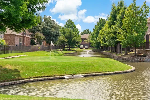 a view of a swimming pool with a yard