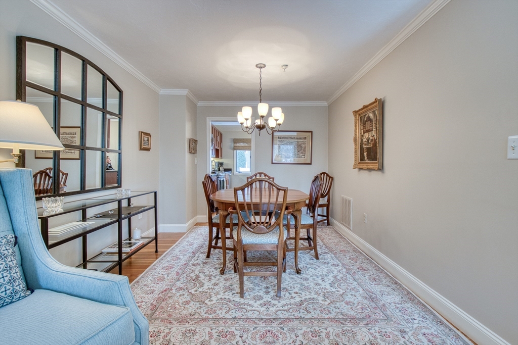 433 Main Street, Unit 4 Medfield, MA 02052 - Photo 12 of 36 a view of a dining room with furniture and chandelier