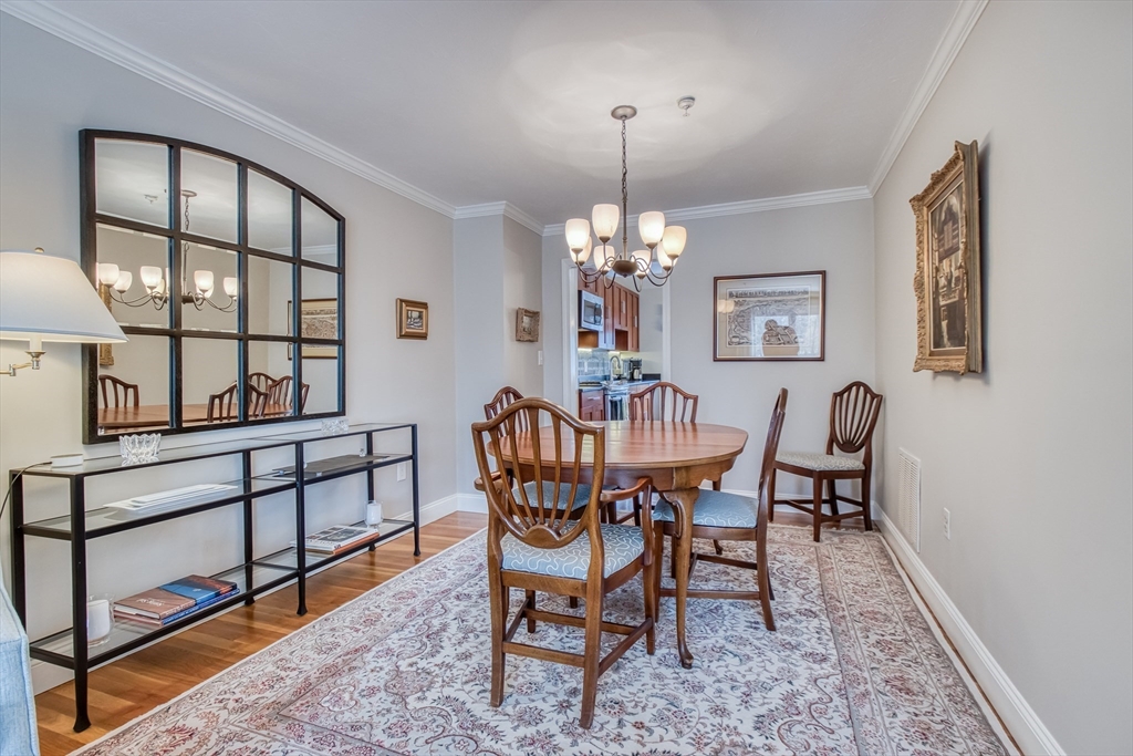 433 Main Street, Unit 4 Medfield, MA 02052 - Photo 13 of 36 a view of a dining room with furniture and chandelier
