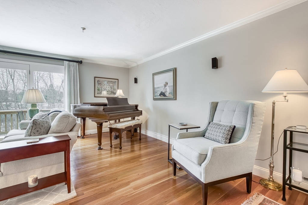 433 Main Street, Unit 4 Medfield, MA 02052 - Photo 14 of 36 a living room with furniture and a wooden floor