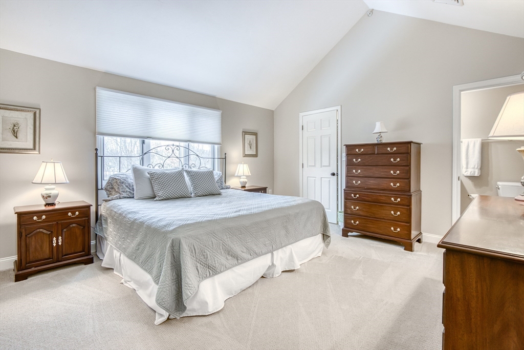 433 Main Street, Unit 4 Medfield, MA 02052 - Photo 18 of 36 a bedroom with a bed and a dresser