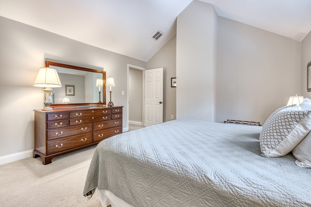 433 Main Street, Unit 4 Medfield, MA 02052 - Photo 20 of 36 a bedroom with a bed and a dresser