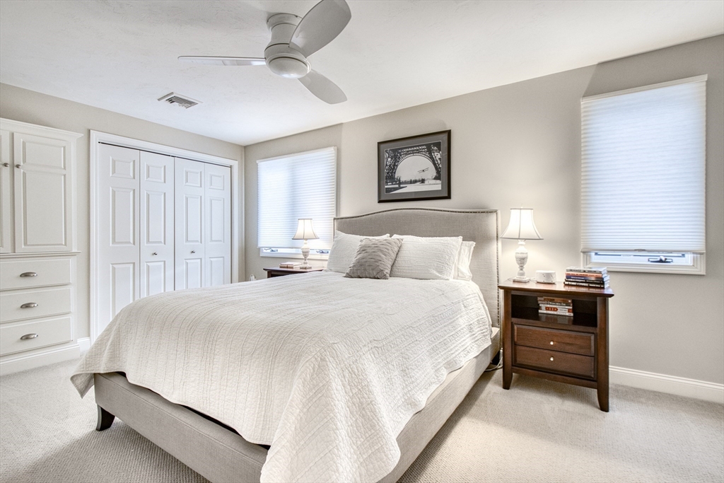 433 Main Street, Unit 4 Medfield, MA 02052 - Photo 22 of 36 a bedroom with a bed and a window