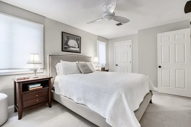 a bathroom with a granite countertop sink mirror and shower