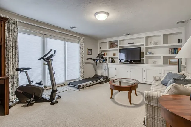 a room with gym equipment and a large window