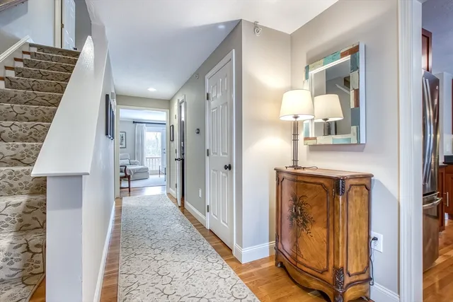 a kitchen with stainless steel appliances granite countertop a refrigerator a stove top oven a sink and dishwasher