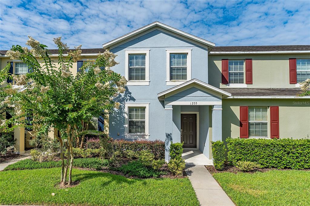 1355 Vasey Road Apopka, FL 32703 - Photo 1 of 41 a front view of a house with a yard and trees
