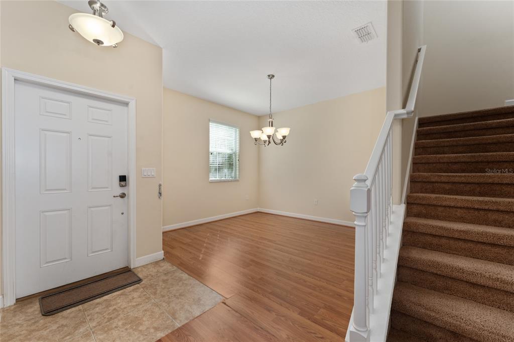 1355 Vasey Road Apopka, FL 32703 - Photo 12 of 41 wooden floor in an empty room with a window