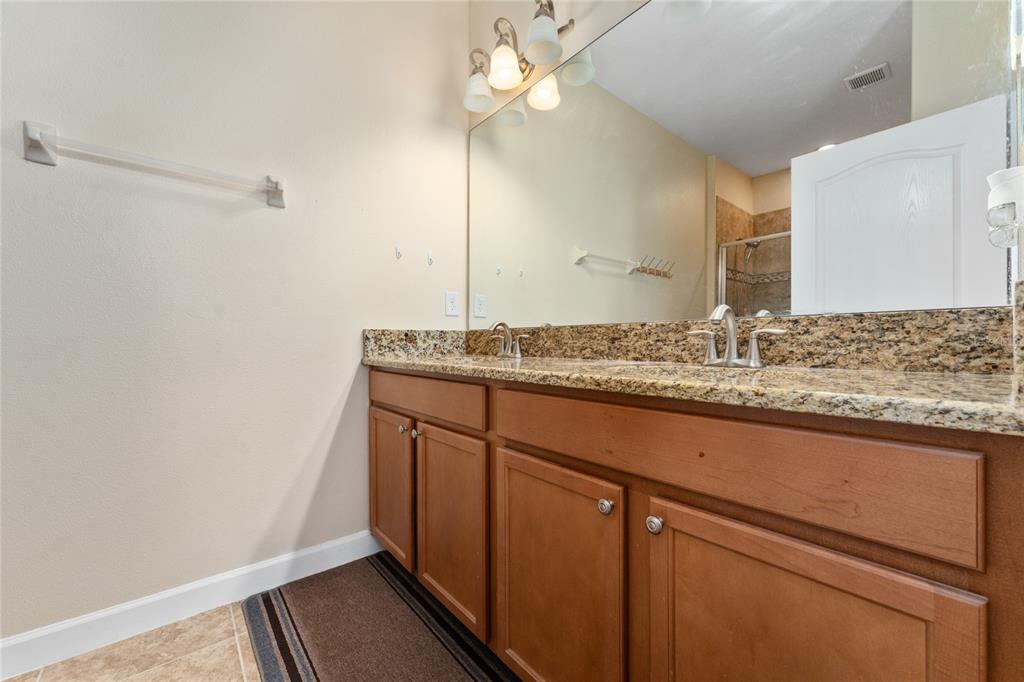 1355 Vasey Road Apopka, FL 32703 - Photo 16 of 41 a bathroom with a granite countertop sink and a mirror