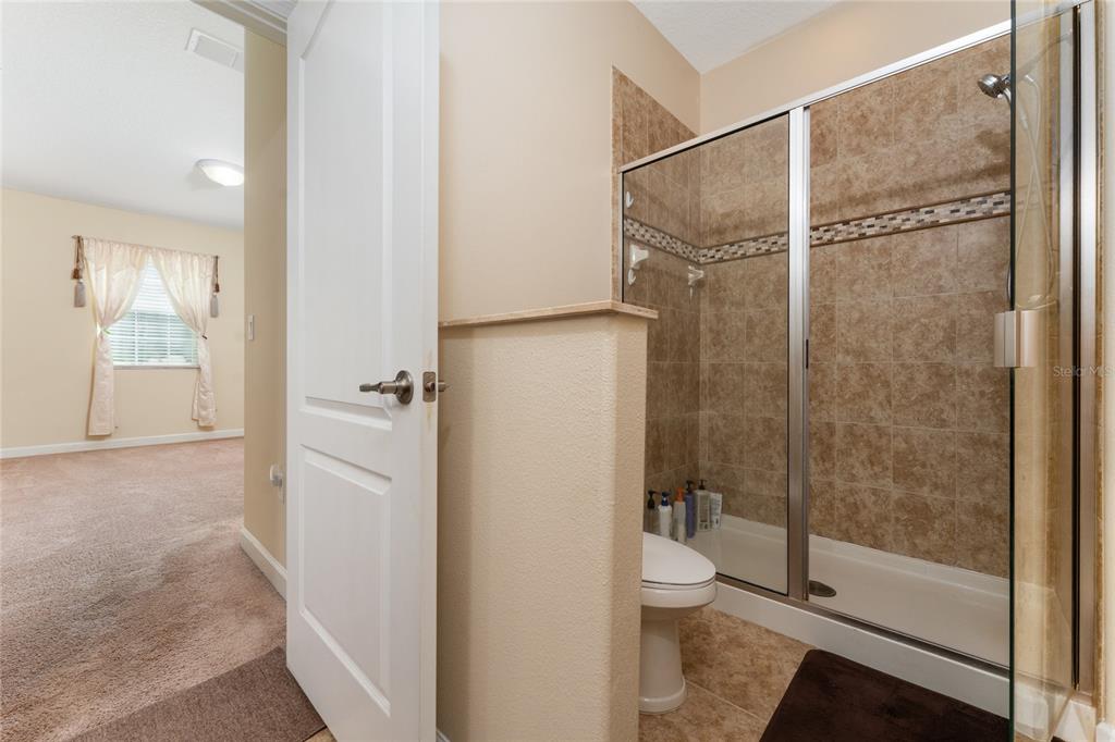 1355 Vasey Road Apopka, FL 32703 - Photo 17 of 41 a bathroom with a granite countertop shower