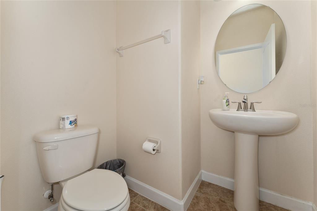 1355 Vasey Road Apopka, FL 32703 - Photo 18 of 41 a bathroom with a sink toilet and a mirror