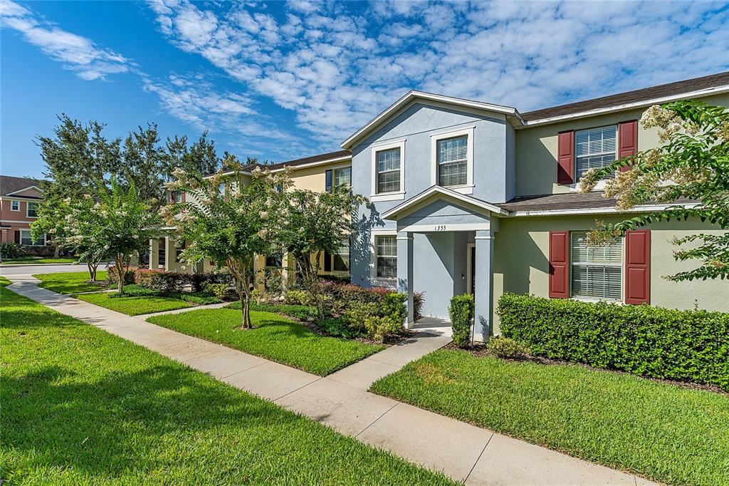 1355 Vasey Road Apopka, FL 32703 - Photo 3 of 41 a front view of a house with a yard
