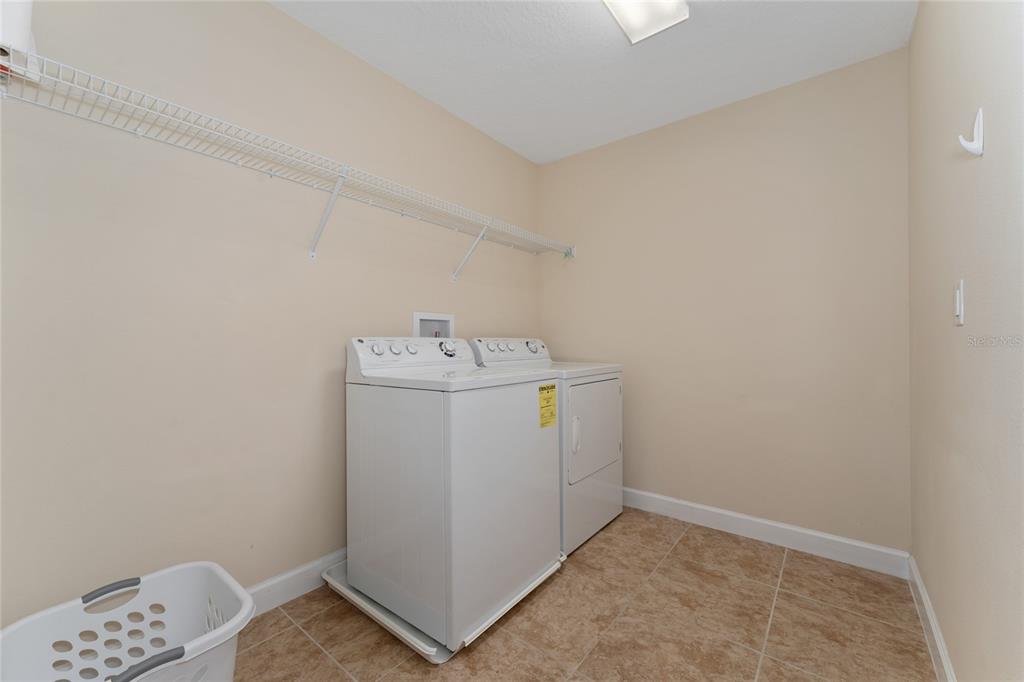 1355 Vasey Road Apopka, FL 32703 - Photo 31 of 41 a utility room with dryer and washer