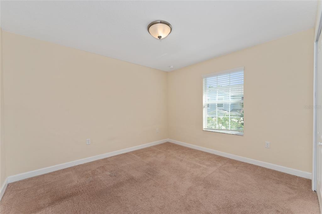 1355 Vasey Road Apopka, FL 32703 - Photo 32 of 41 an empty room with a fan and a window