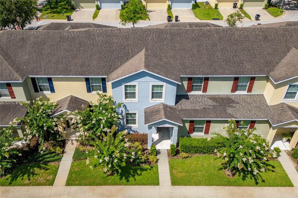 1355 Vasey Road Apopka, FL 32703 - Photo 4 of 41 front view of house with a yard and potted plants