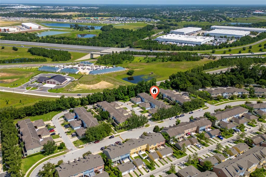 1355 Vasey Road Apopka, FL 32703 - Photo 5 of 41 an aerial view of a city with lots of residential buildings ocean and mountain view in back