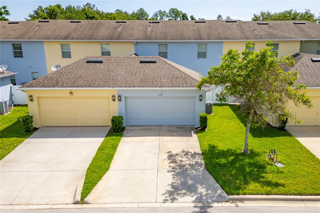 1355 Vasey Road Apopka, FL 32703 - Photo 8 of 41 a front view of a house with garden