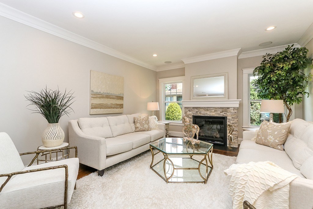 80 Sachem Road Needham, MA 02494 - Photo 12 of 26 a living room with furniture and a fireplace