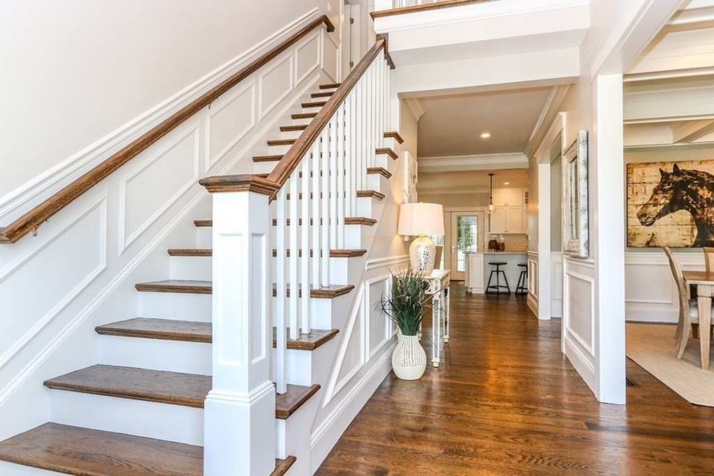 80 Sachem Road Needham, MA 02494 - Photo 14 of 26 a view of staircase with lots of frames on wall and a desk