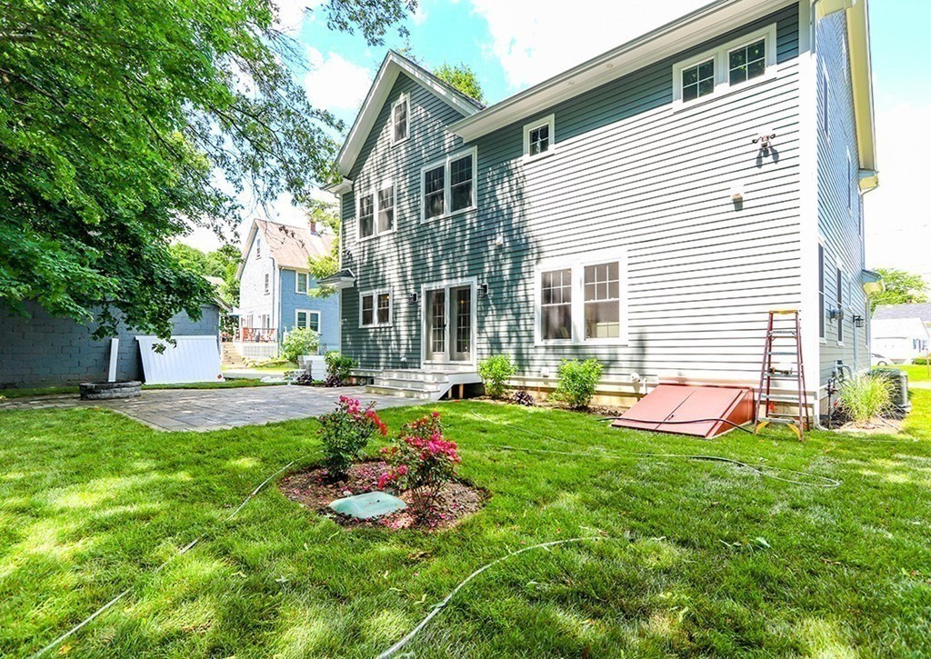 80 Sachem Road Needham, MA 02494 - Photo 25 of 26 a view of a house with a yard and sitting area
