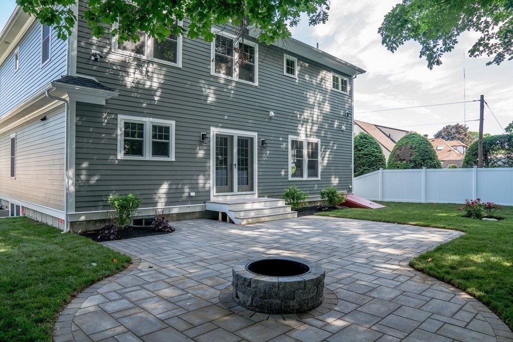 80 Sachem Road Needham, MA 02494 - Photo 26 of 26 a backyard of house with outdoor seating