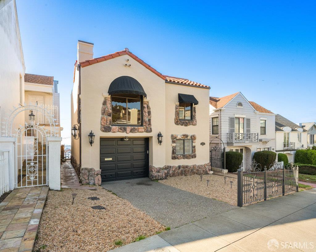 1653 16th Avenue San Francisco, CA 94122 - Photo 1 of 33 a front view of a house with a yard