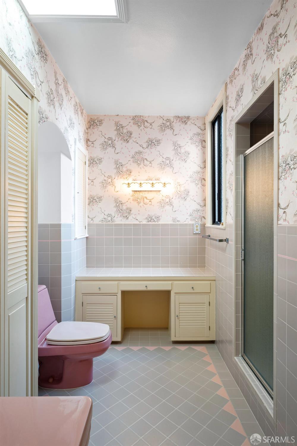 1653 16th Avenue San Francisco, CA 94122 - Photo 23 of 33 a living room with furniture and a large window