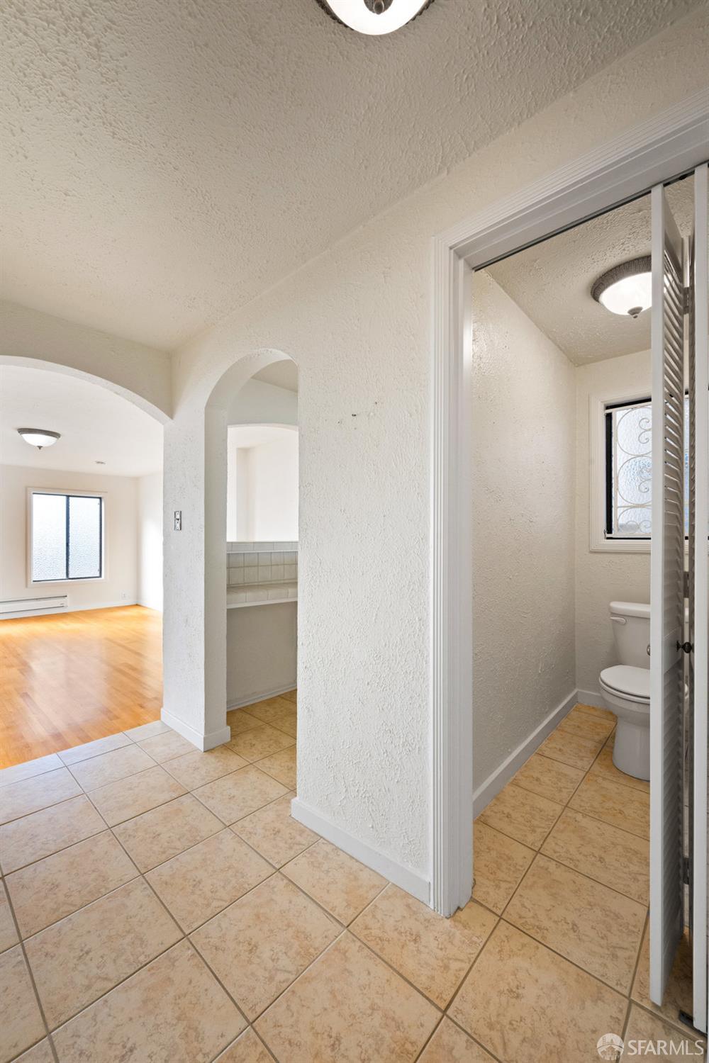 1653 16th Avenue San Francisco, CA 94122 - Photo 25 of 33 a view of an empty room with glass door and a window