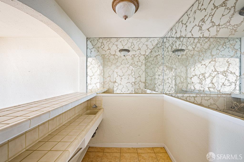 1653 16th Avenue San Francisco, CA 94122 - Photo 26 of 33 a bathroom with a bathtub and window