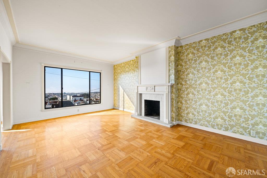 1653 16th Avenue San Francisco, CA 94122 - Photo 7 of 33 a view of empty room with a fireplace and a window