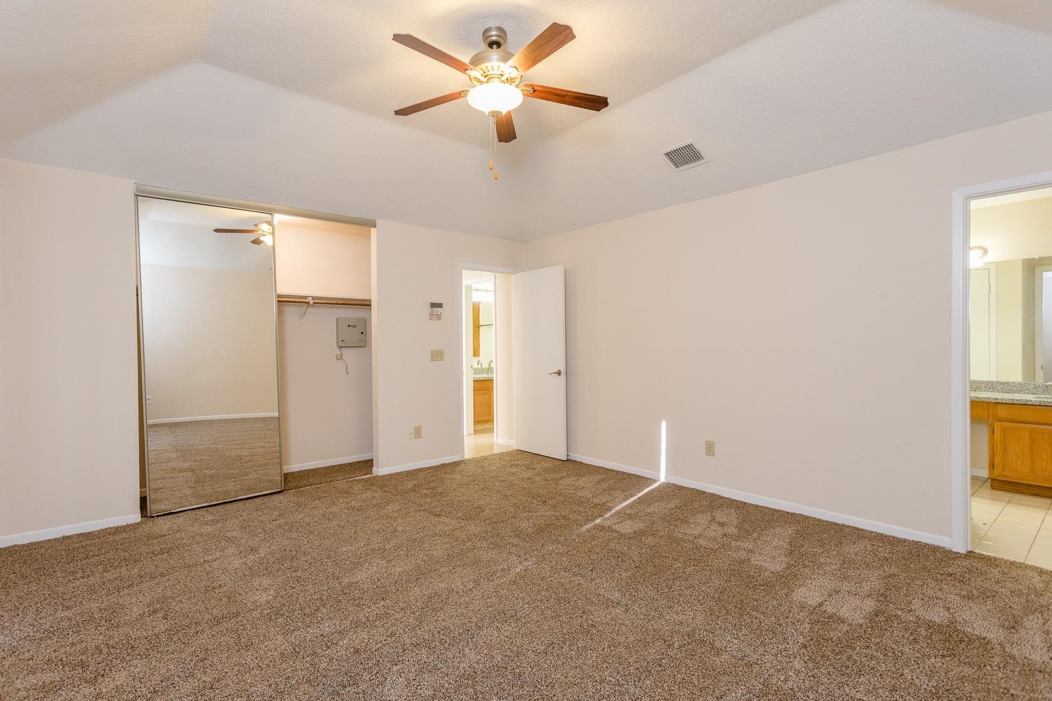 9206 Towerstone Drive Spring, TX 77379 - Photo 4 of 7 an empty room with closet and windows