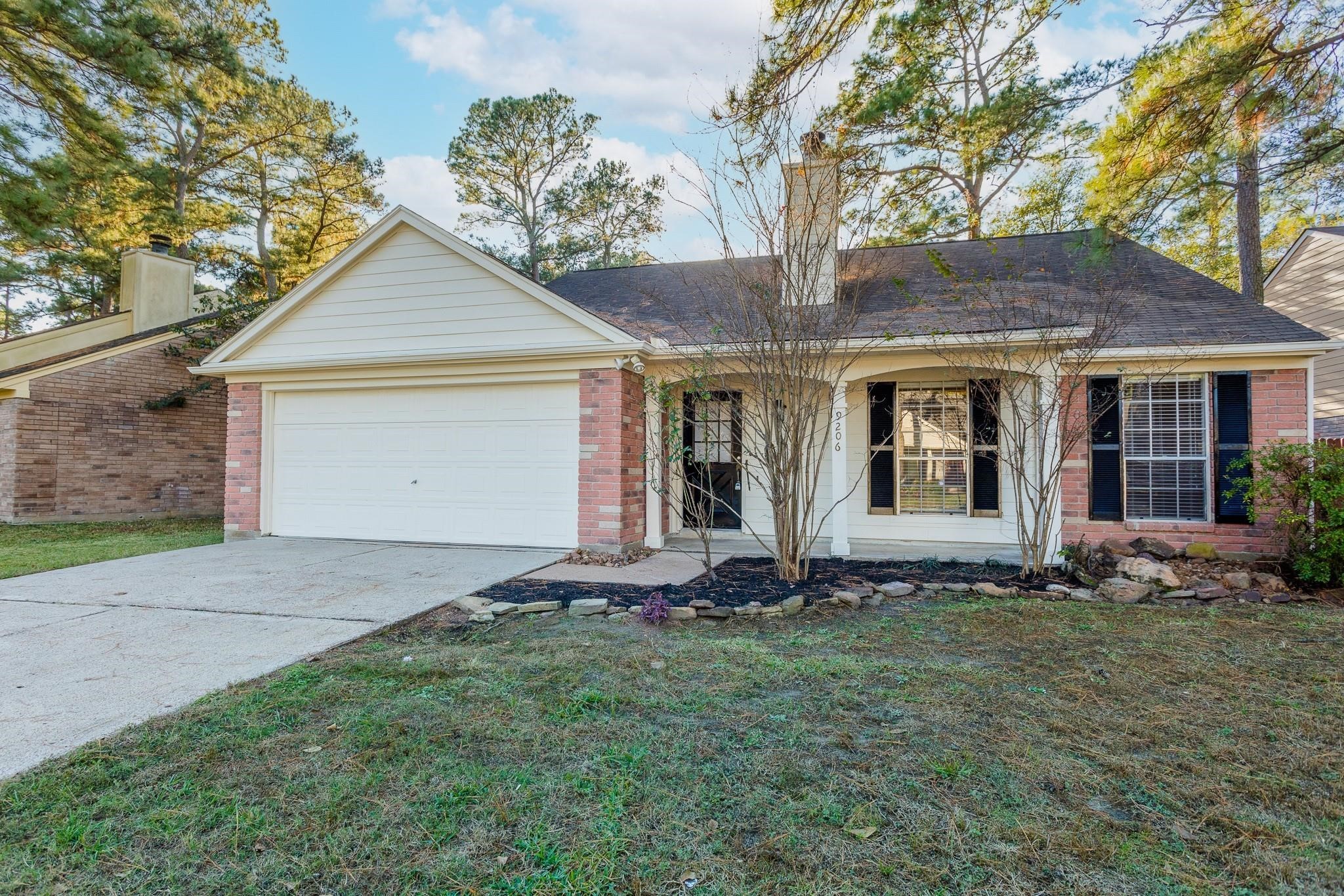 9206 Towerstone Drive Spring, TX 77379 - Photo 7 of 7 a front view of a house with a yard