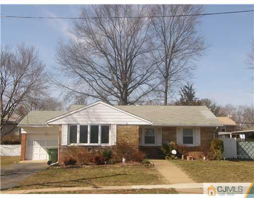 8 Roger Road Edison, NJ 08817 - Photo 1 of 10 a front view of a house with garden
