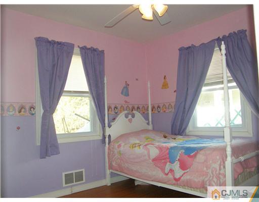 8 Roger Road Edison, NJ 08817 - Photo 7 of 10 a bedroom with a bed and a window