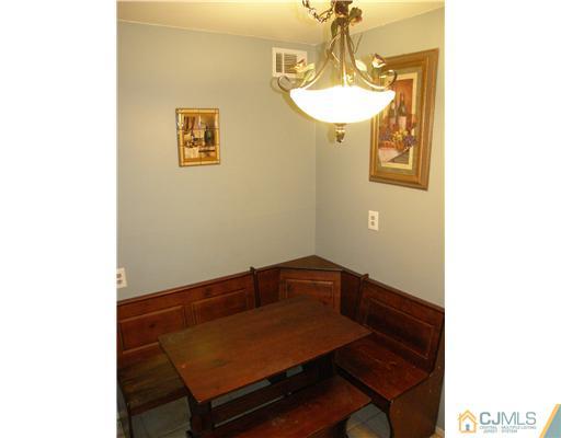 8 Roger Road Edison, NJ 08817 - Photo 8 of 10 a view of a room with a table and chairs