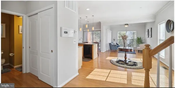 a living room with furniture a rug and a chandelier