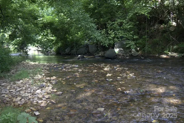 a view of a building and car parked on the street