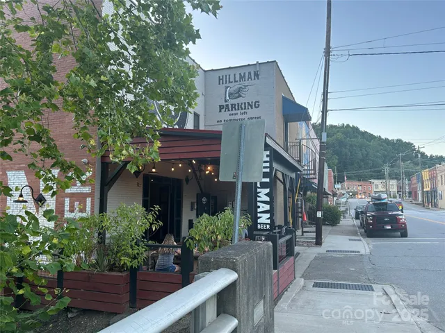 a view of a wooden house with a yard