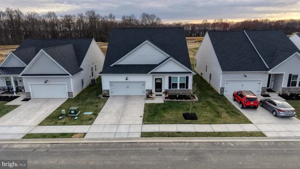 a sign that is sitting in front of a house