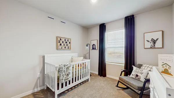 a bedroom with furniture and a window