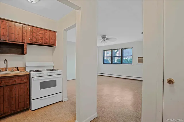 a kitchen with stainless steel appliances granite countertop a stove and a refrigerator