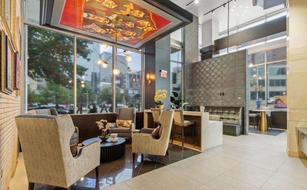 1700 Cedar Springs Road, Unit 2508 Dallas, TX 75201 - Photo 16 of 40 Common area with a high ceiling and floor to ceiling windows