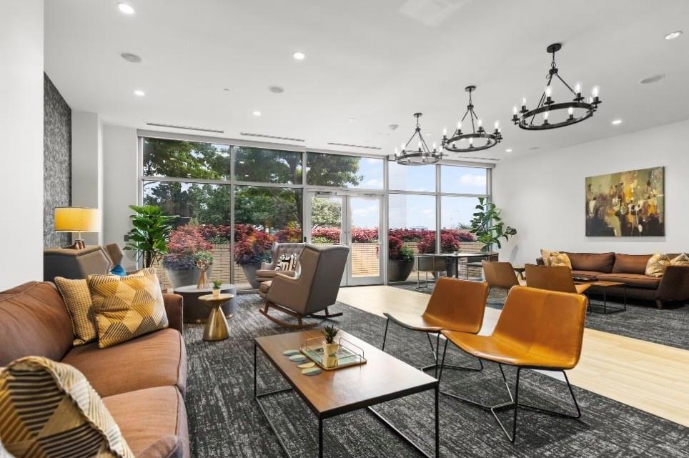 1700 Cedar Springs Road, Unit 2508 Dallas, TX 75201 - Photo 19 of 40 a living room with lots of furniture and a large window