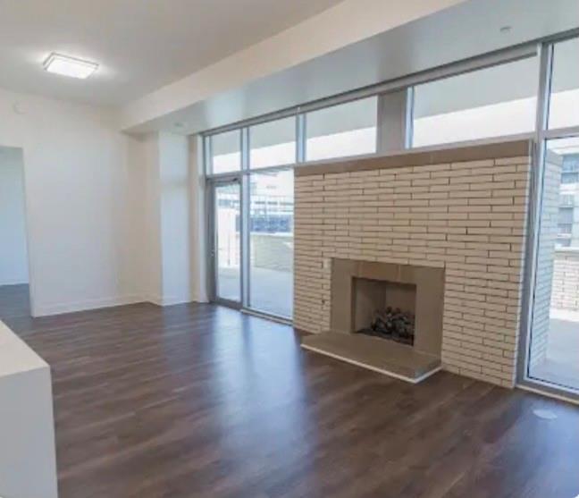 1700 Cedar Springs Road, Unit 2508 Dallas, TX 75201 - Photo 27 of 40 an empty room with wooden floor and fireplace
