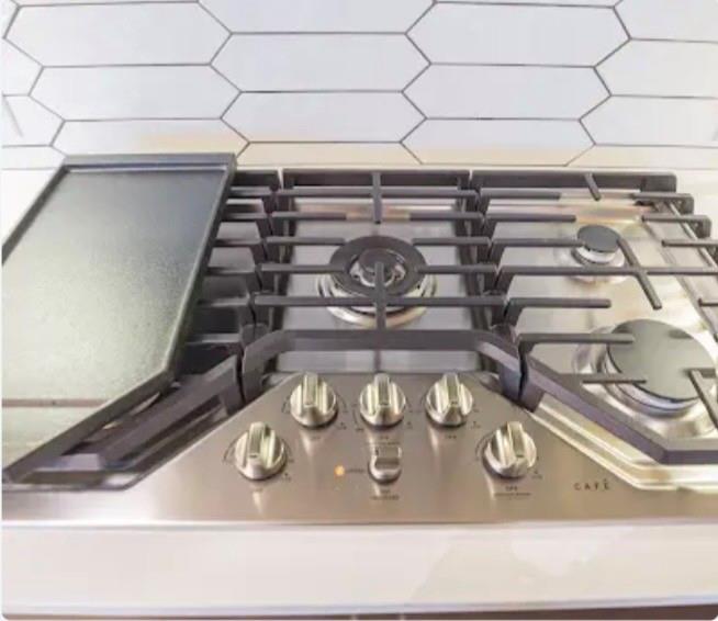 1700 Cedar Springs Road, Unit 2508 Dallas, TX 75201 - Photo 29 of 40 Kitchen view of stainless steel range with gas cooktop