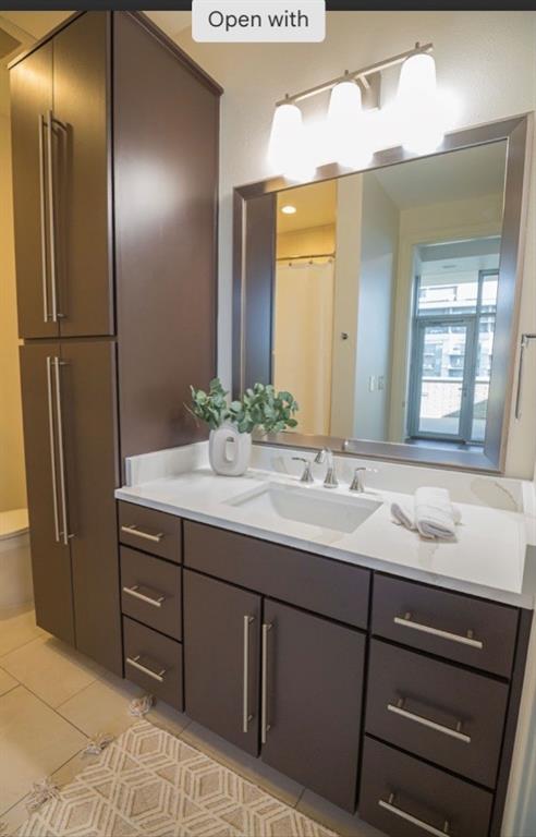 1700 Cedar Springs Road, Unit 2508 Dallas, TX 75201 - Photo 35 of 40 a bathroom with a sink and a mirror