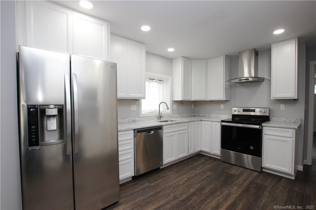 32 Spruce Mountain Road Danbury, CT 06810 - Photo 1 of 1 a kitchen with stainless steel appliances granite countertop a refrigerator a sink and a stove