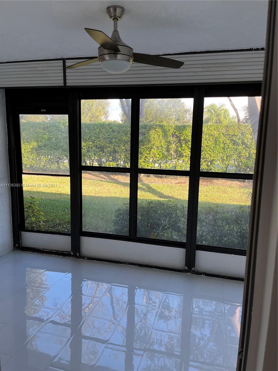 8309 Springtree Road, Unit 8309 Boca Raton, FL 33496 - Photo 17 of 18 a view of large windows in an empty room